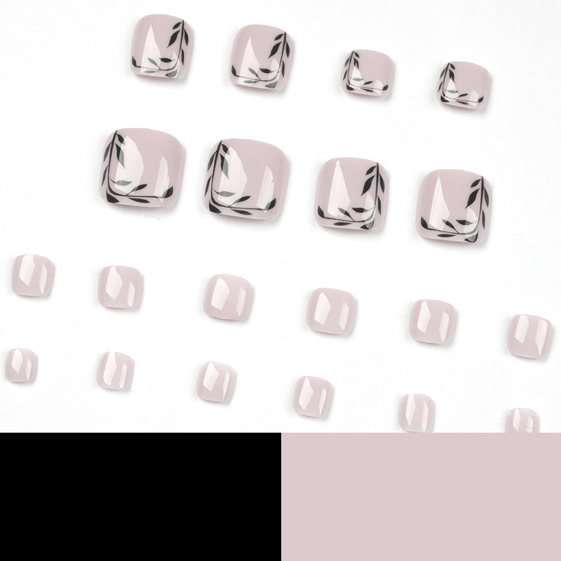 Artful toenail art with delicate leaf motifs Kalsten