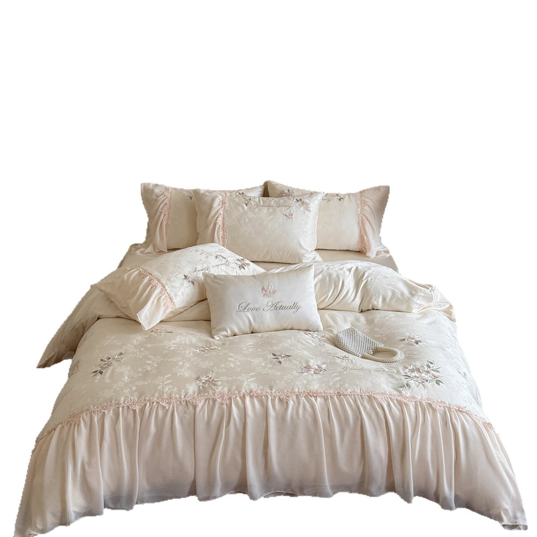 Romantic satin bedding set with embroidered floral design, ruffle and pillowcases
