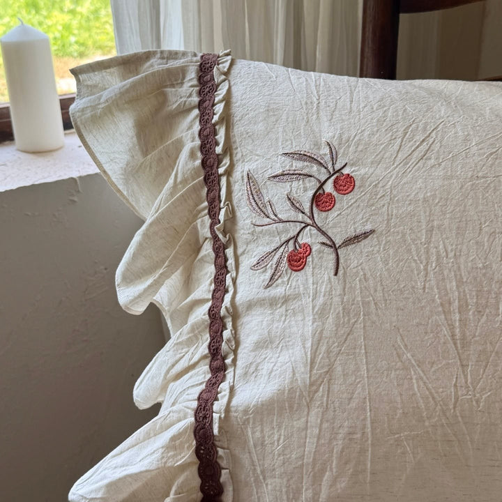 Linen bedding set with cherry embroidery and ruffles