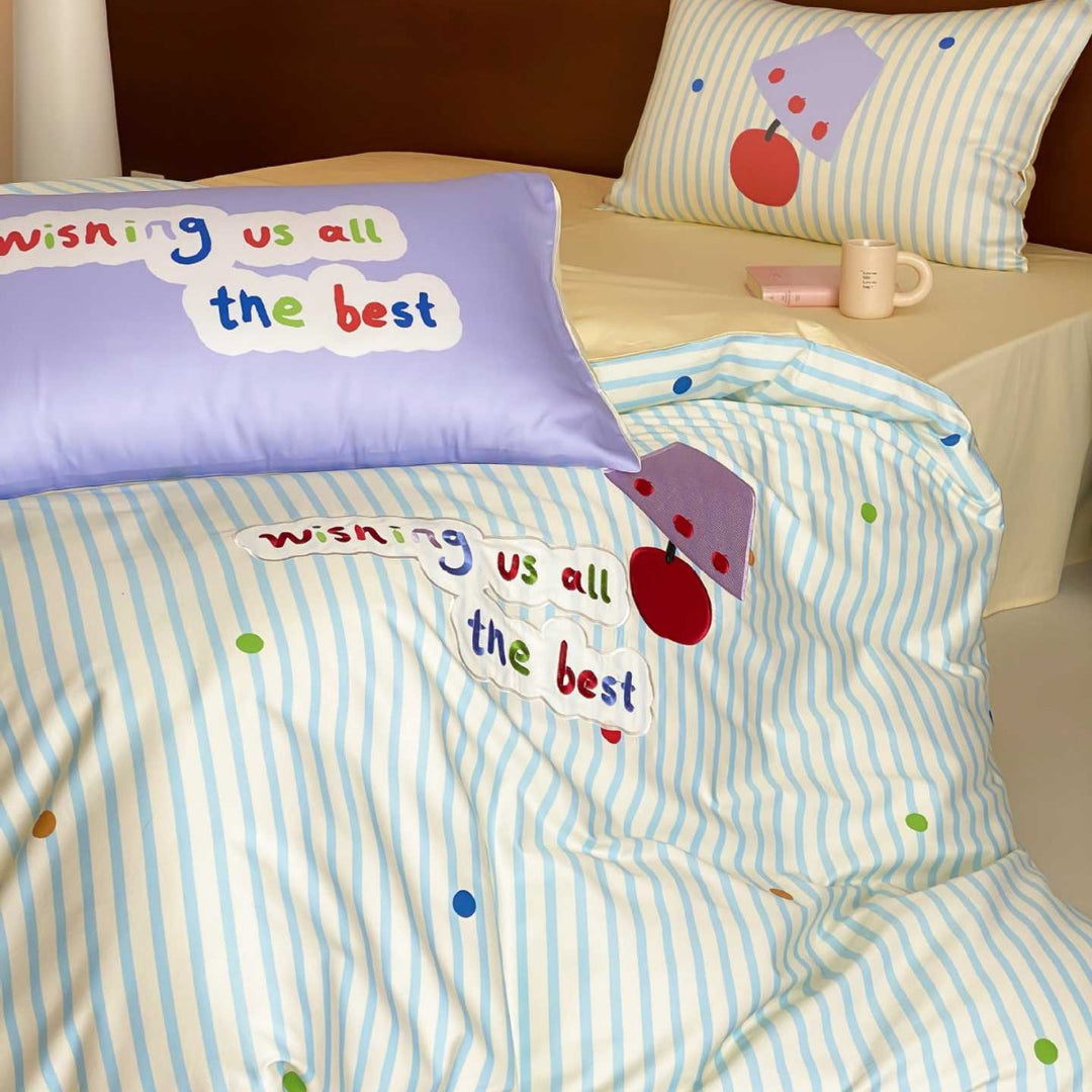 Children's bedding set made of cotton percale with striped design, appliquéd lettering, and playful dot appliqués
