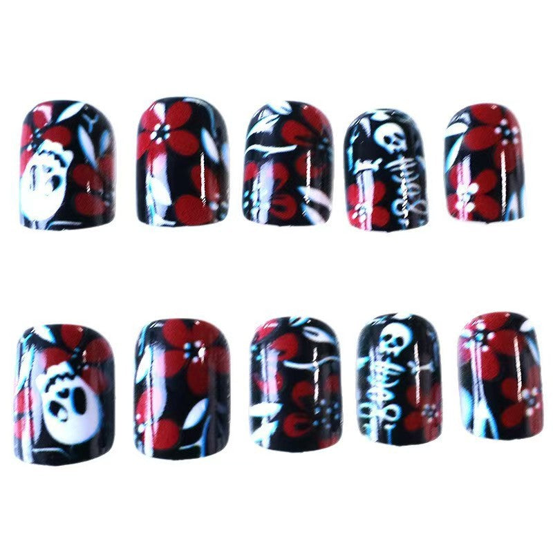Artificial nail set with creepy skull design and floral accents Kalsten