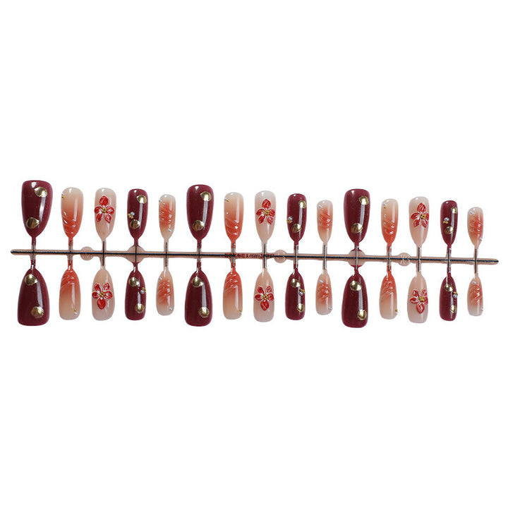 Acrylic nail set with elegant floral design and shimmering accents Kalsten
