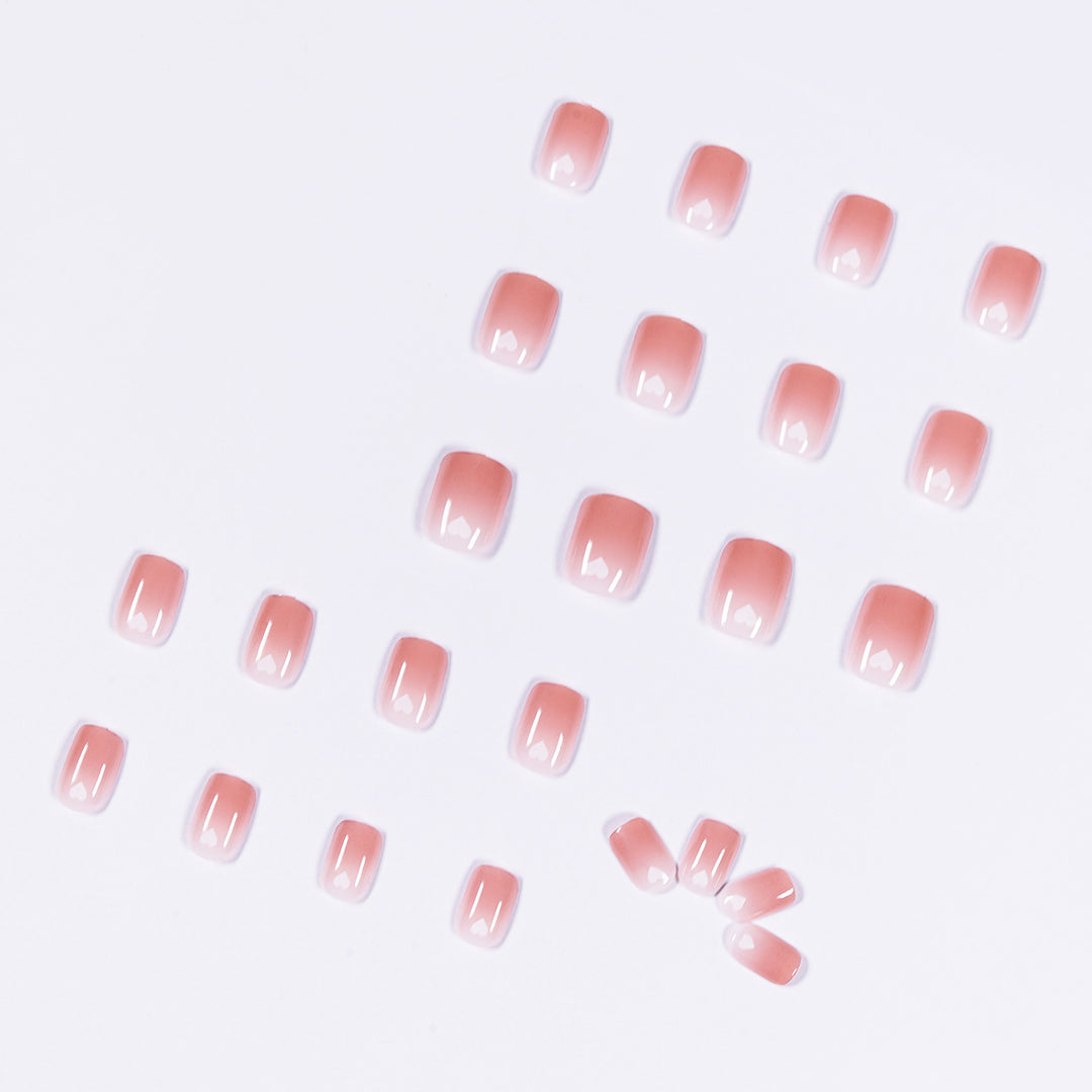 Artful nail art with heart-shaped accents and gentle ombre effect Kalsten