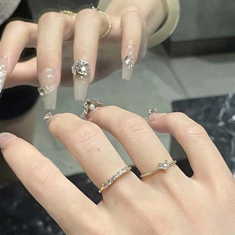 Art nail set with filigree decorations and glamorous accents Kalsten