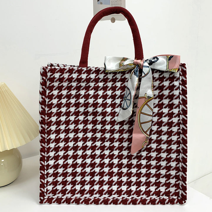 Elegant Houndstooth Handbag with Decorative Bow