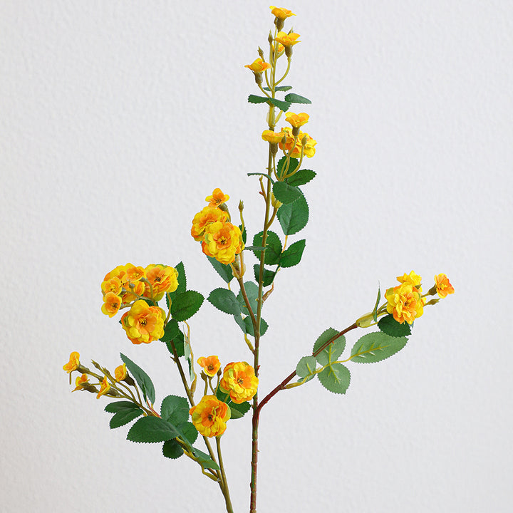Artificial branch with decorative flowers