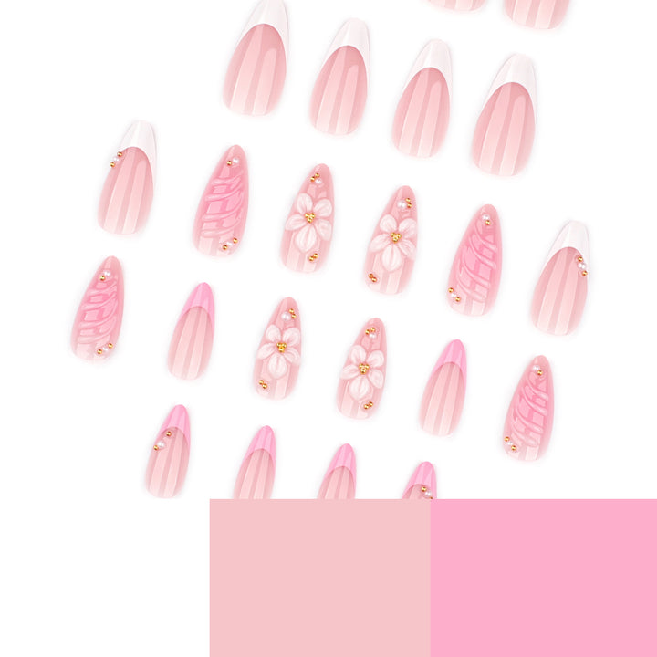 Artificial nail art with floral design and glitter accents Kalsten