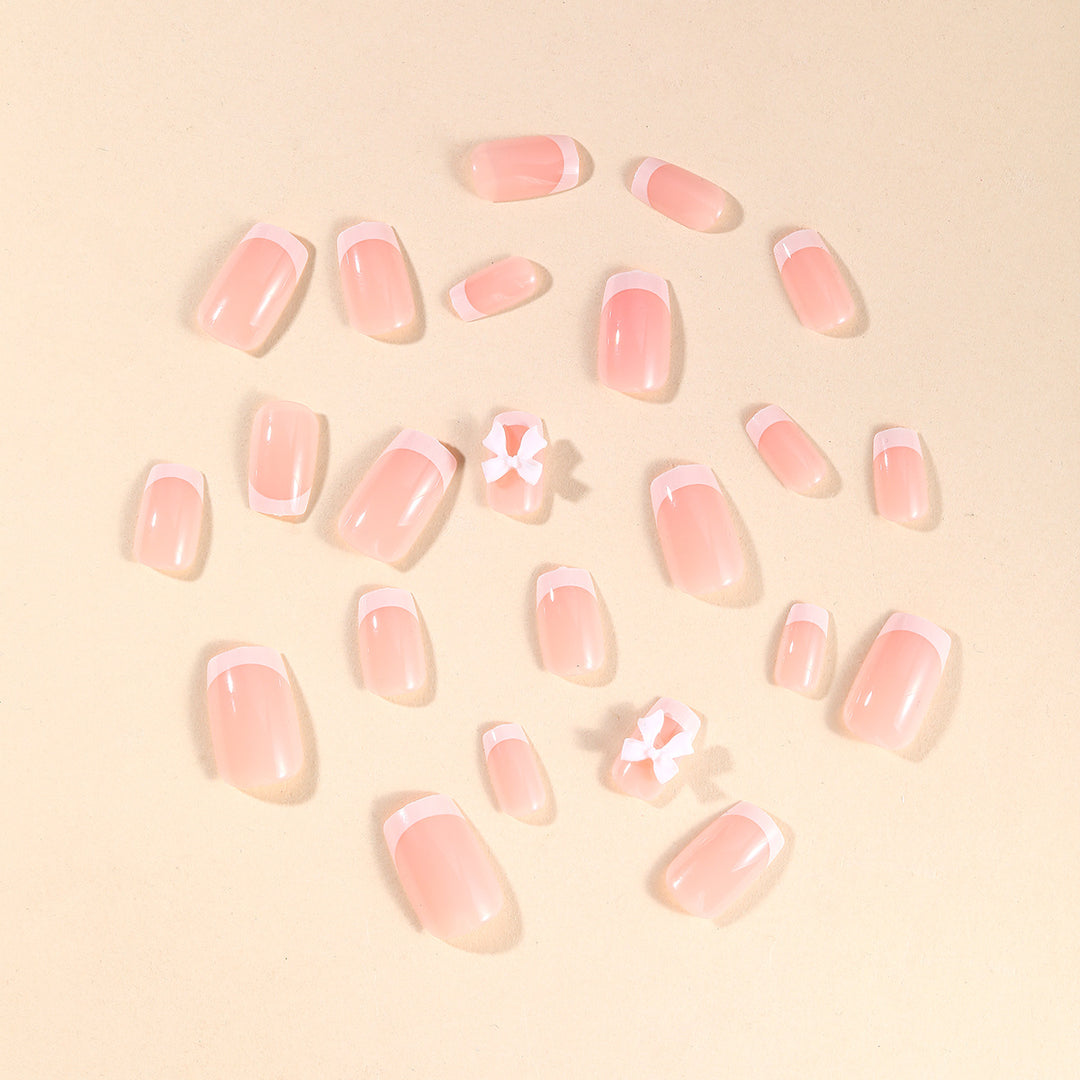 Elegant French Tip Nail Art with Bow Embellishments Kalsten