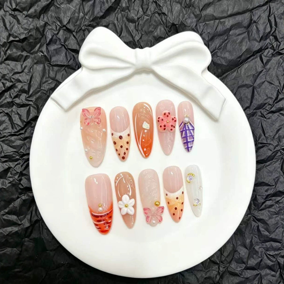 Artistic Press-On Nails Set with Floral and Decorative Accents