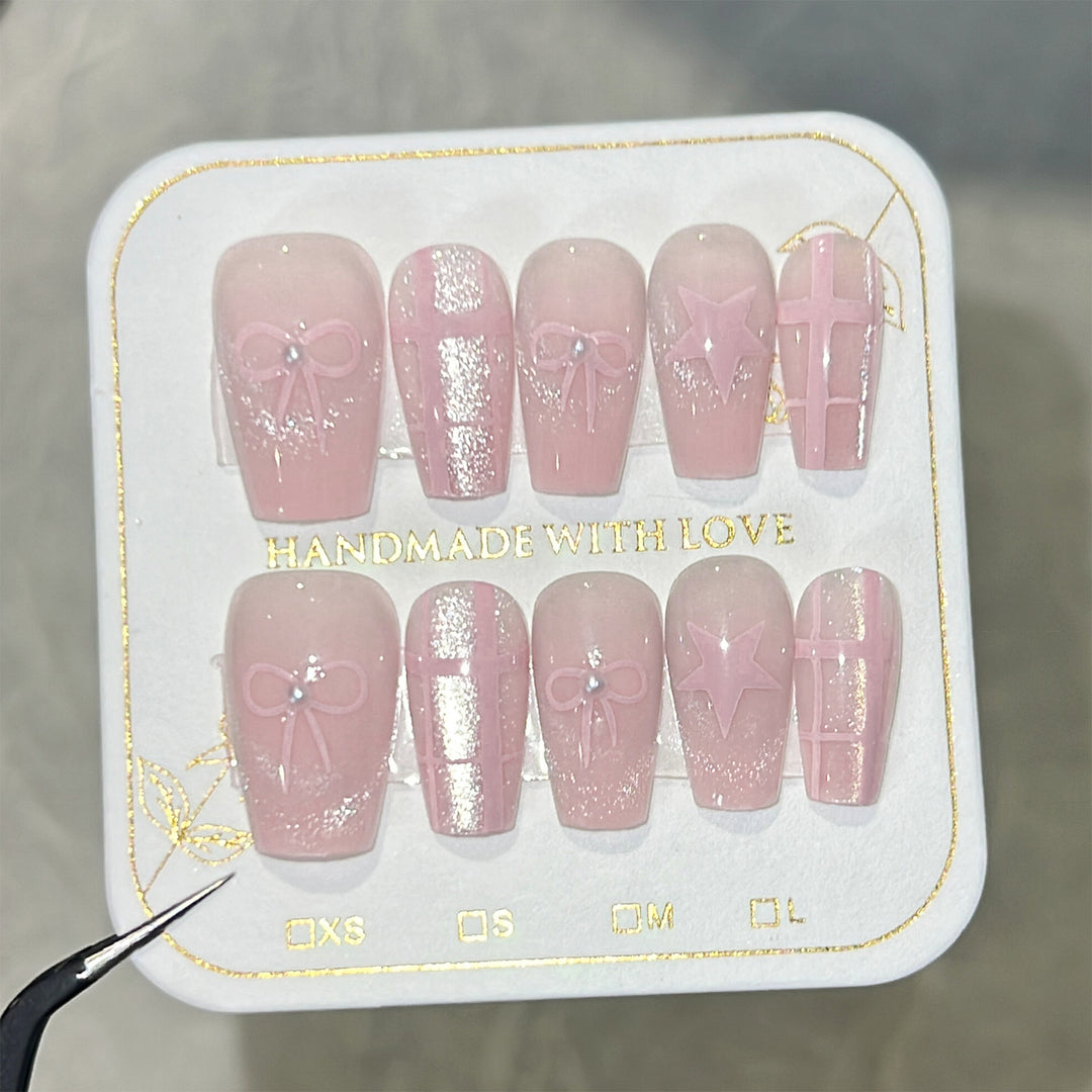 Artistic acrylic nails with elegant bow and star designs Kalsten