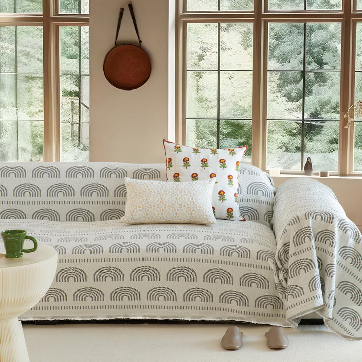 Washable sofa cover with geometric jacquard pattern and non-slip underside