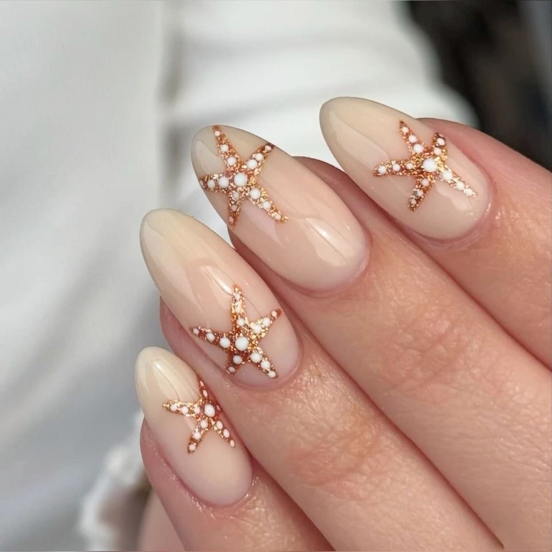 Glamorous stiletto nails with elegant star design Kalsten