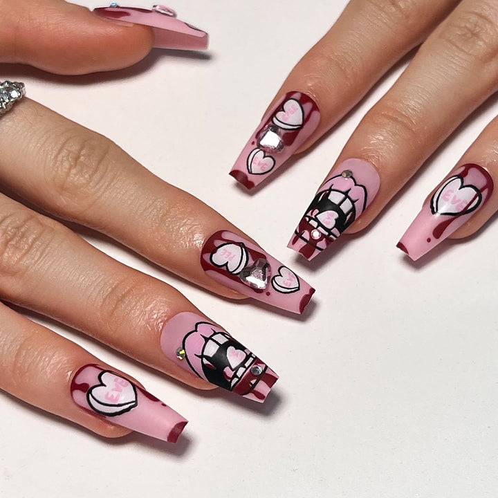 Artful stiletto nails with hearts and glitter accents Kalsten