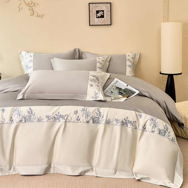 Luxurious bedding set with embroidered border and satin look