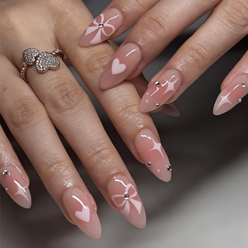 Artificial nail set with romantic heart and bow motifs Kalsten