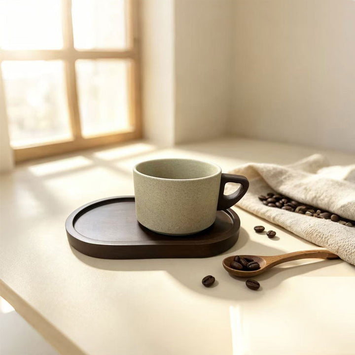 Ceramic mug with wooden handle and saucer