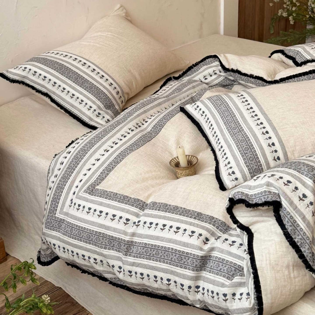 Country house style bedding set with striped floral border and fringes