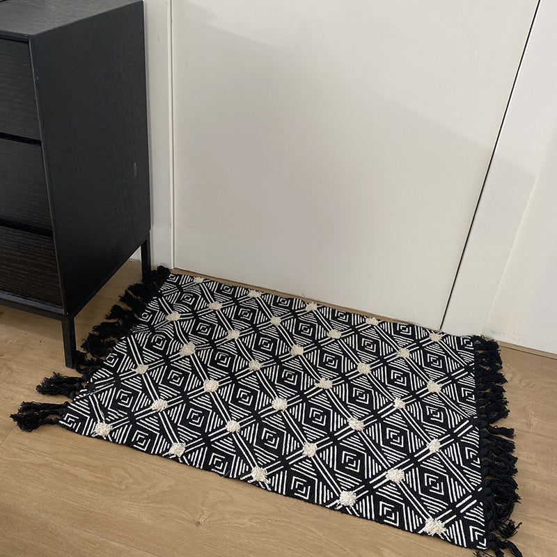 Handwoven cotton runner with pompom tufting and decorative fringes