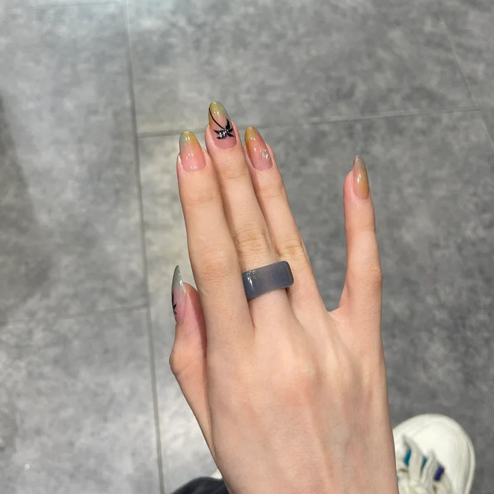 Artistic Ombre Nail Design with Floral Accents