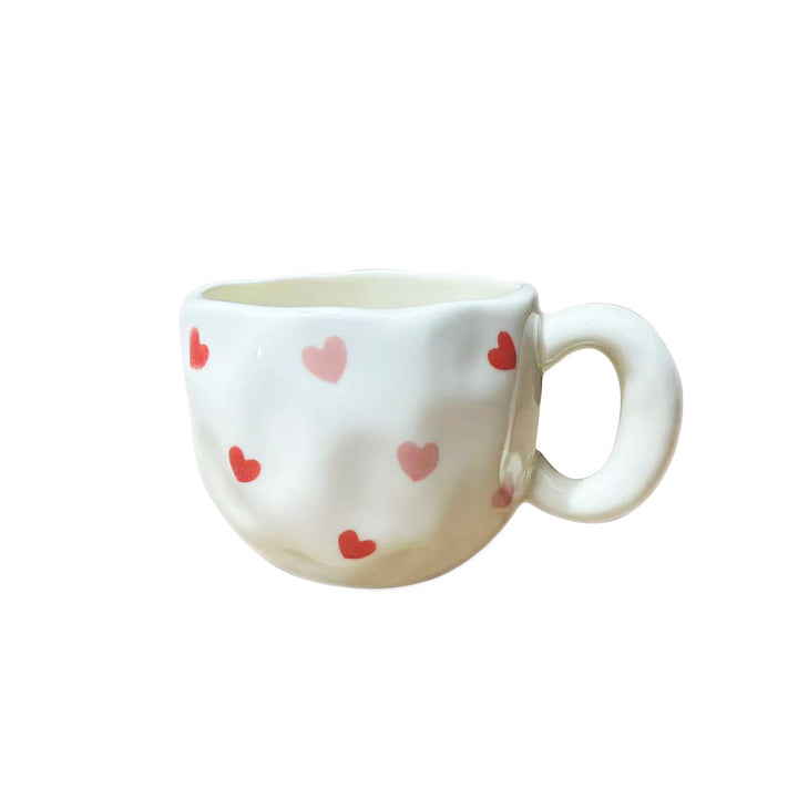 Ceramic mug with hand-painted tulip pattern and organic shape