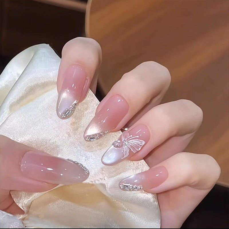 Artificial nail set with festive gift design and elegant glitter accents Kalsten