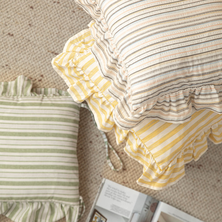 Striped chair cushion with ties, ruffled hem and linen look