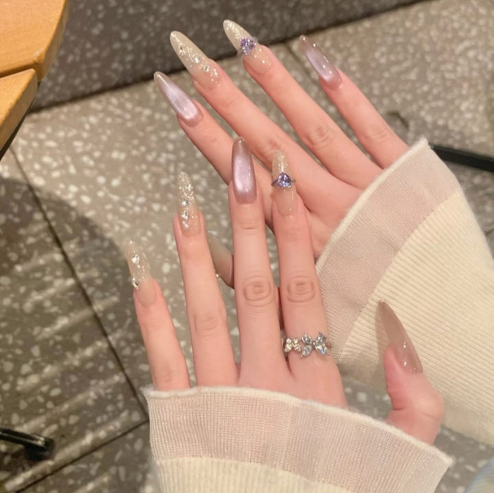 Elegant Long Stiletto Nail Extensions with Gem Accents