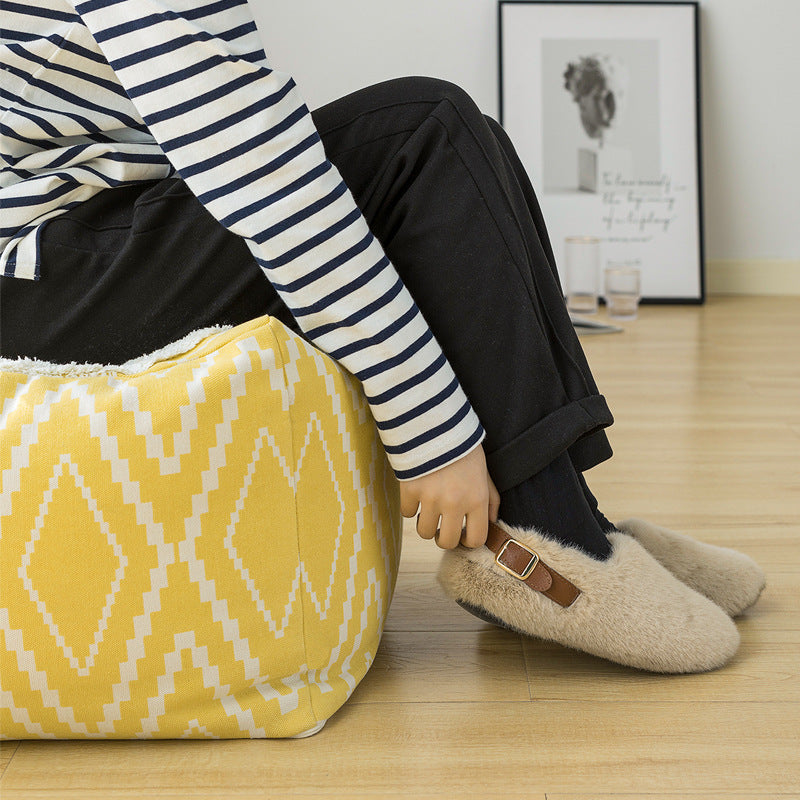 Padded footstool pouf with plush top and woven diamond pattern