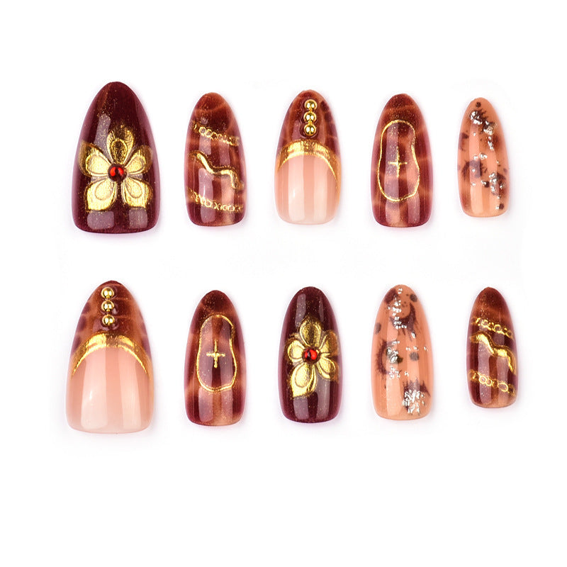 Deluxe artificial nails with golden accents Kalsten