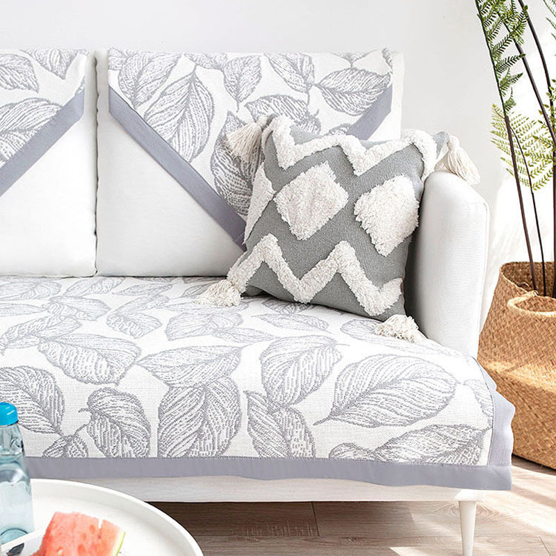 Universal sofa protective cover for three-seater with leaf print, non-slip underside and separate armrest covers Kalsten