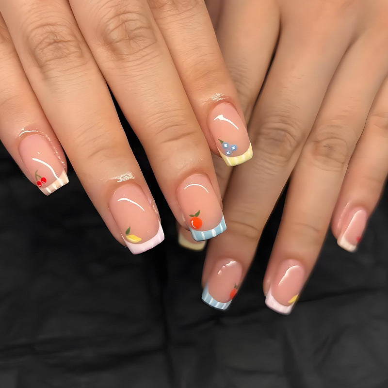 Nail art set with cheerful fruit designs and colorful accents Kalsten
