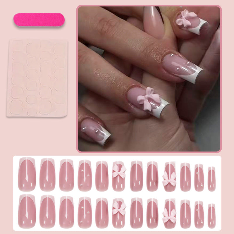 Nail art set with playful ribbon designs and elegant accents Kalsten