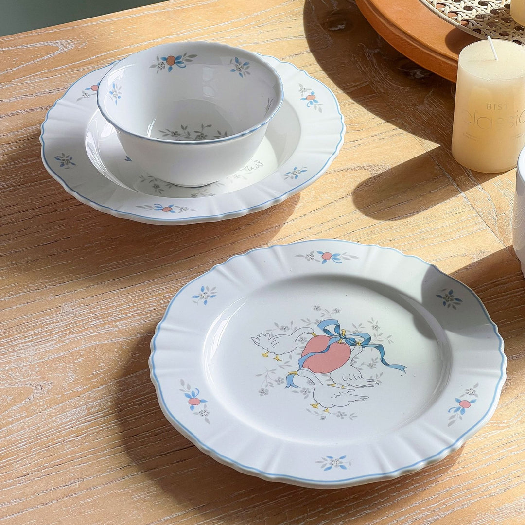 Decorative porcelain soup plate with ribbed edge and duck motif