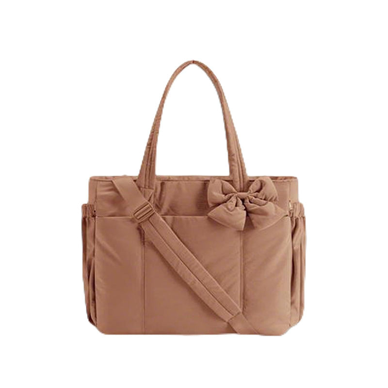 Multifunctional tote bag with detachable shoulder straps and decorative bow Kalsten
