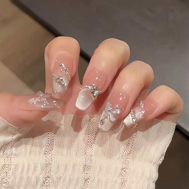 Artificial nails with glamorous decorations and shine Kalsten
