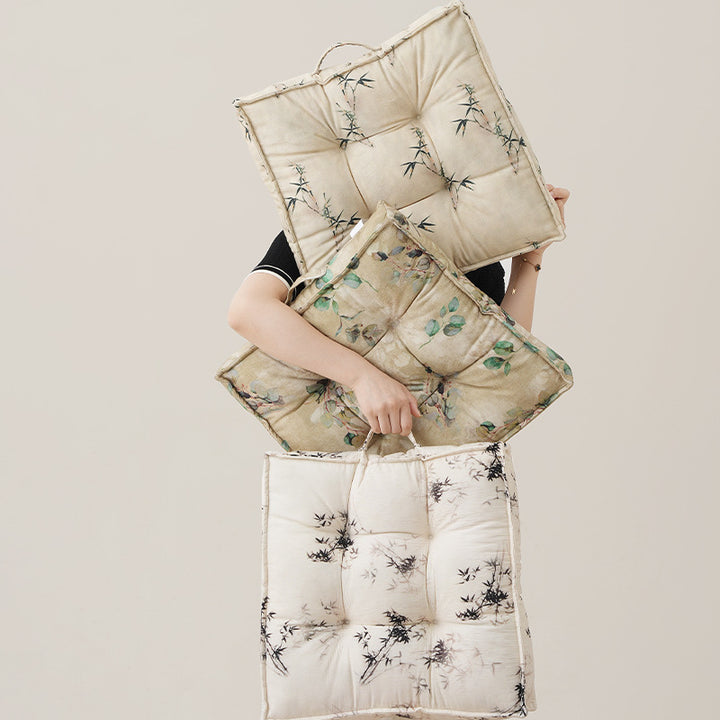 Padded seat cushion with tufting and bamboo motif