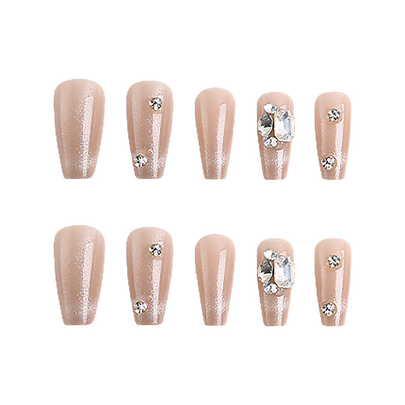 Acrylic nail set with glamorous glitter accents and elegant jewelry embellishments Kalsten
