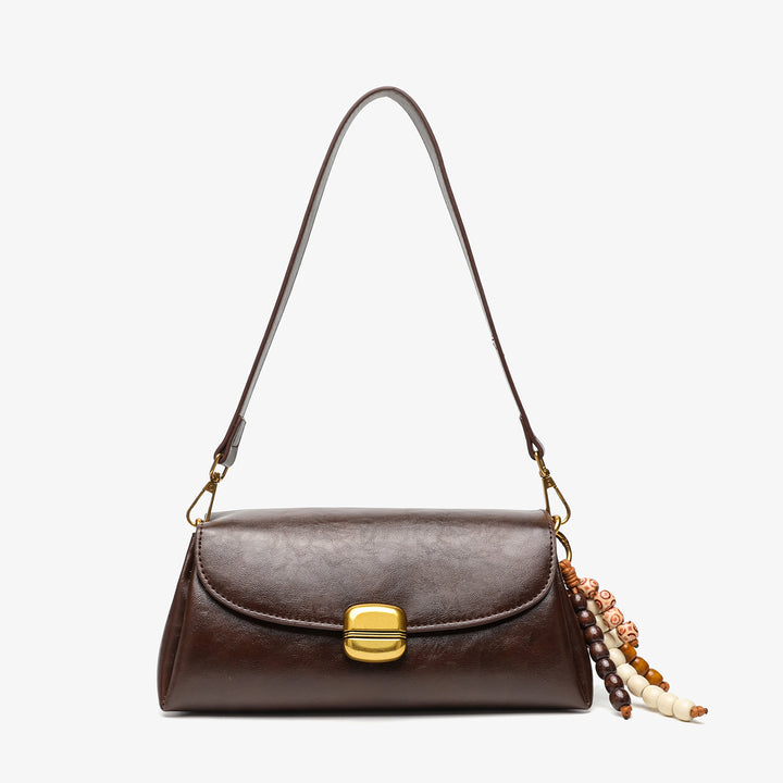 Elegant Handheld Shoulder Bag with Decorative Beaded Charm