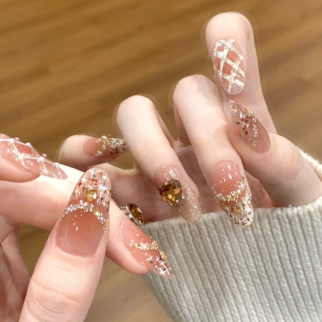 Glamorous artificial nails with glitter and heart design Kalsten