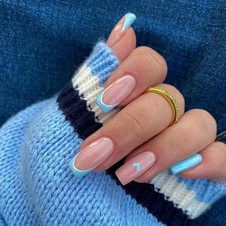 Artful nail art with pastel blue accents Kalsten