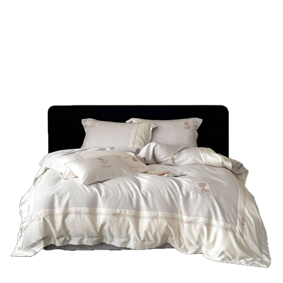 Luxurious cotton satin bed linen set with jacquard rose pattern and embroidered silhouette applications