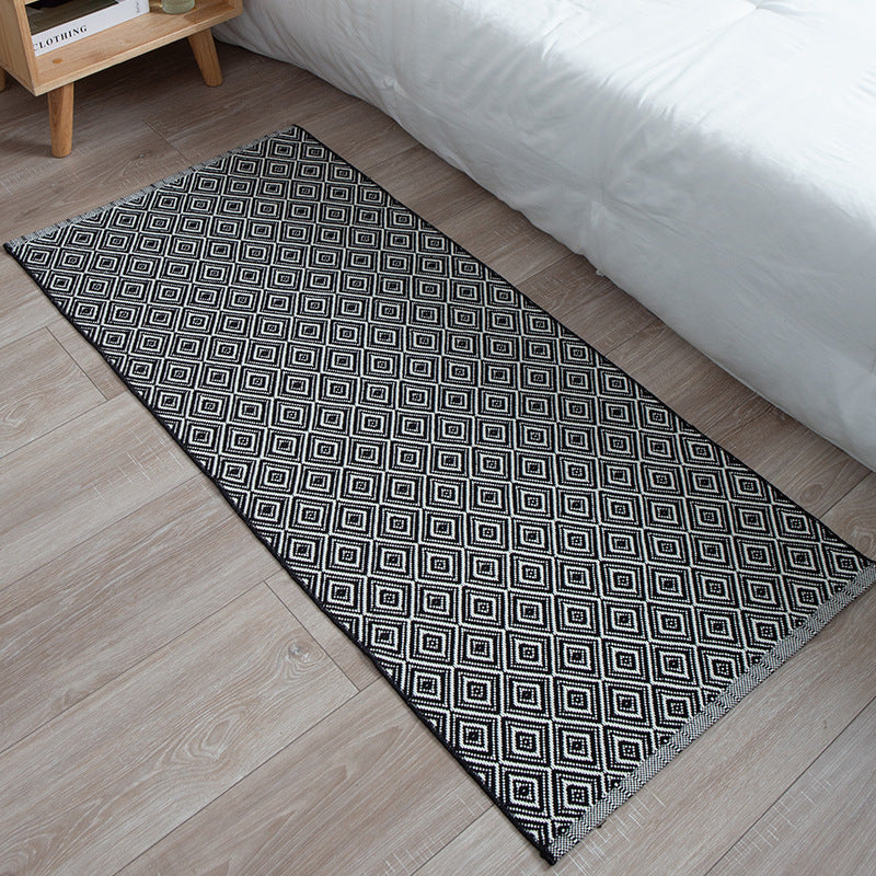 woven living room runner with fringes and geometric weave pattern