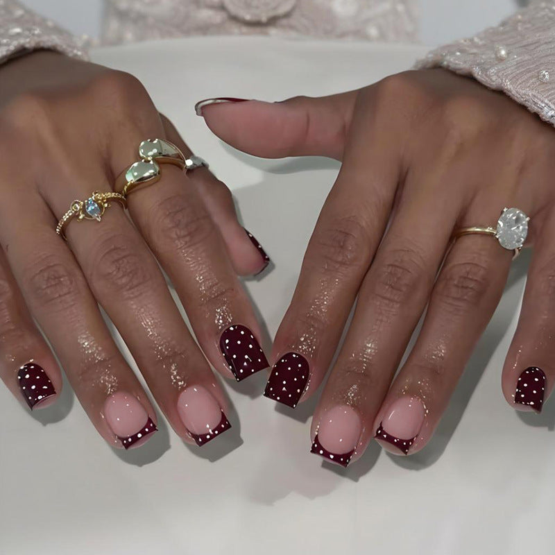 Art nail set with elegant French tips and playful accents Kalsten