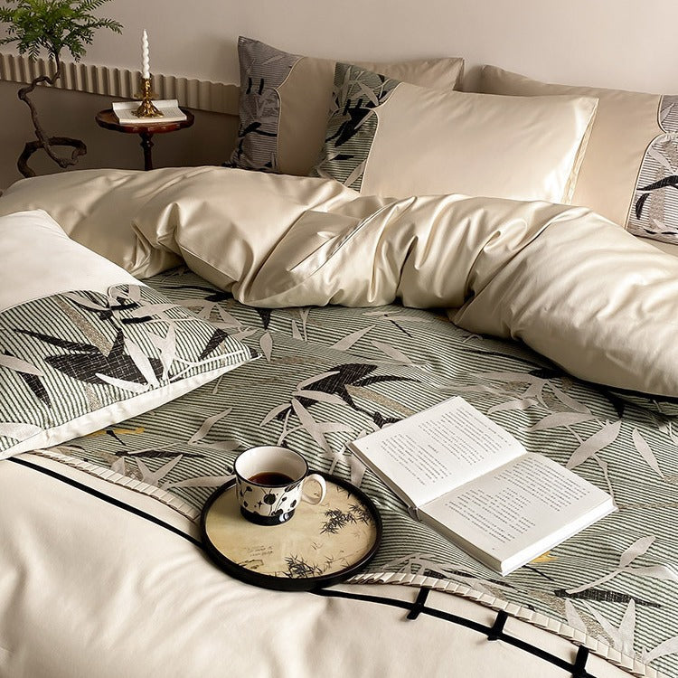 Reversible satin bedding set with quilted décor and botanical bamboo print