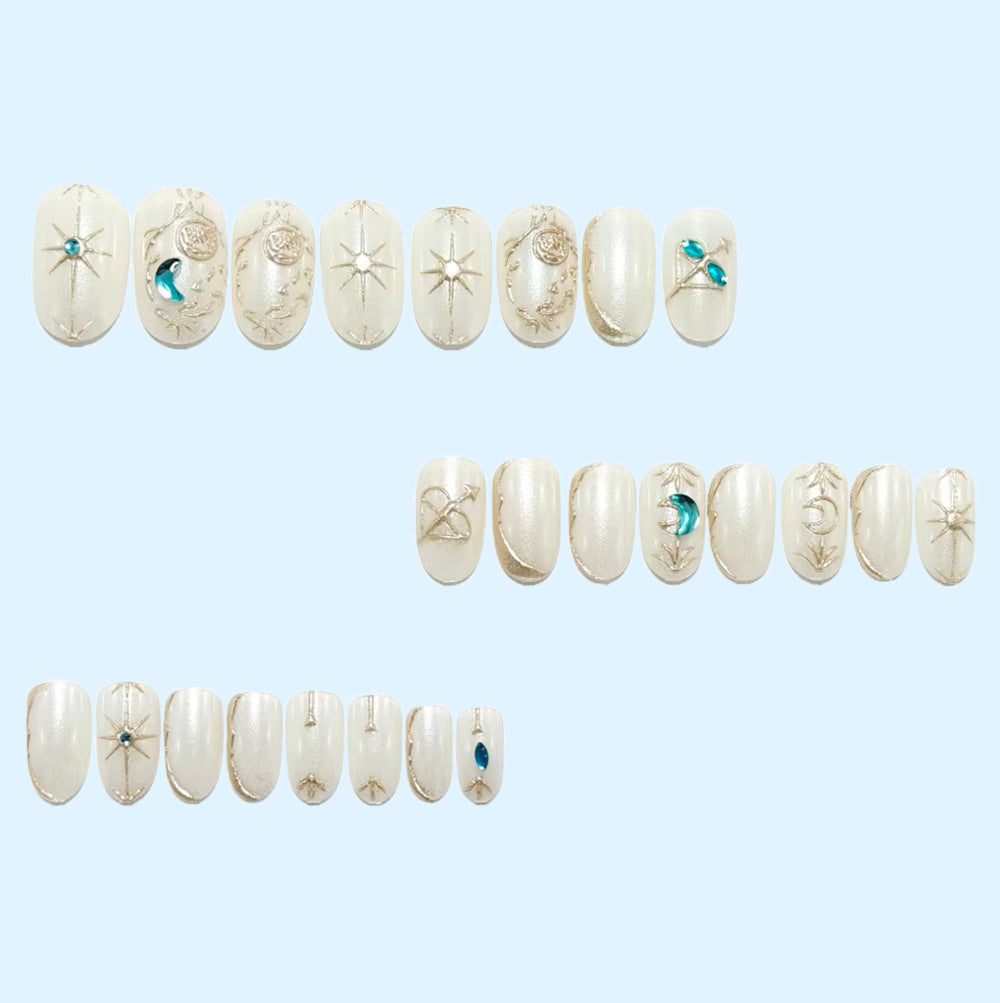 Artificial nails with elegant jewelry embellishments Kalsten