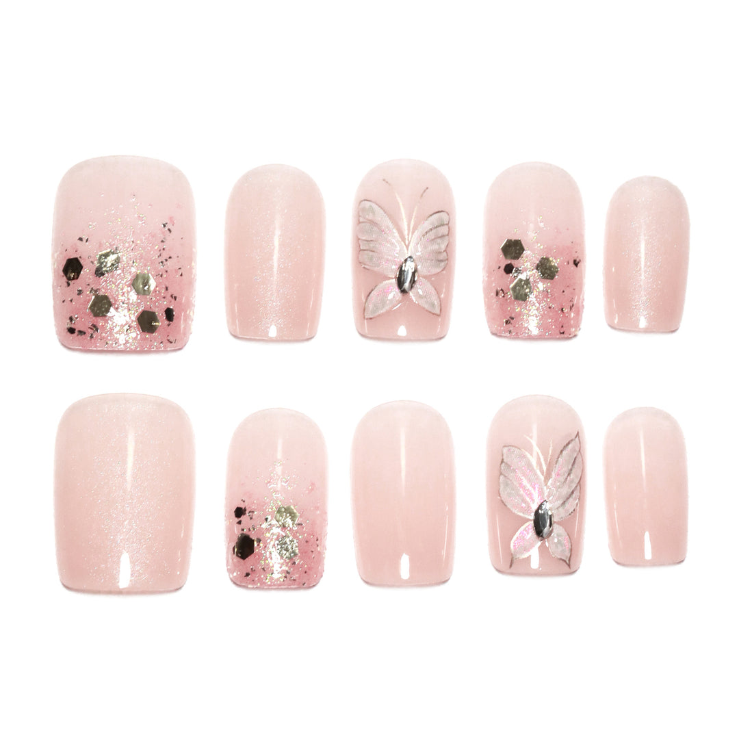 Artful nail art with butterfly designs and glitter accents Kalsten