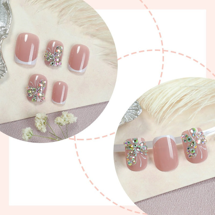 Artifical nail set with sparkling accents and elegant bows Kalsten