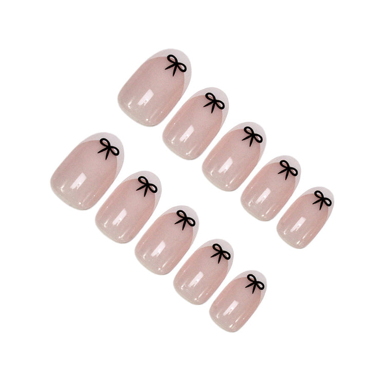 Acrylic nail set with playful bow design Kalsten