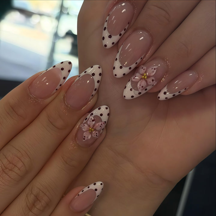 Creative artificial nails with floral design and glamorous accents Kalsten