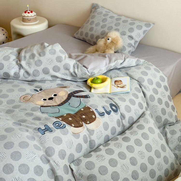 Child-friendly bedding set with embroidered rabbit motif and dotted woven texture